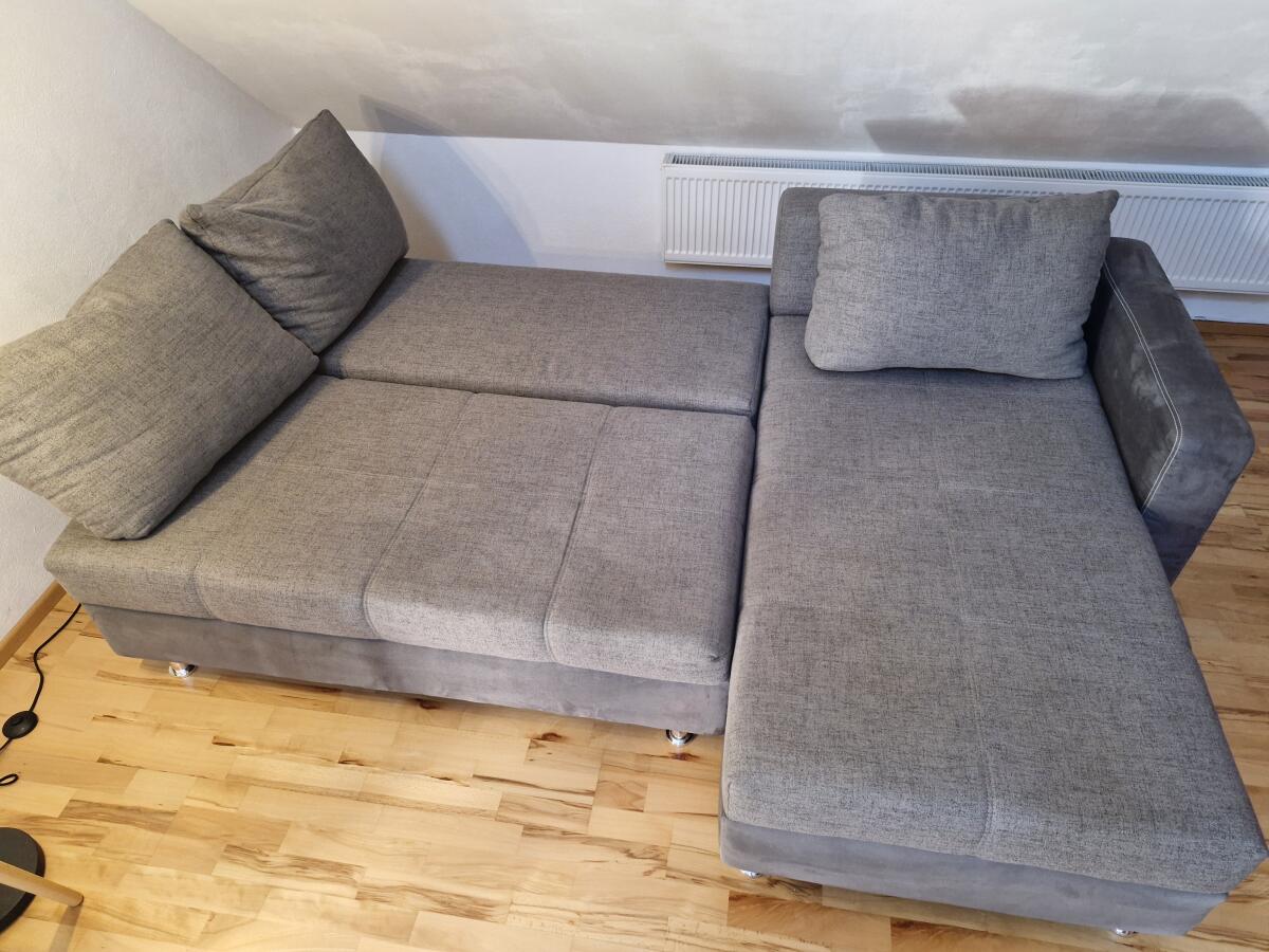 Gepflegte graue Schlafcouch mit Stauraum und Bettfunktion 2