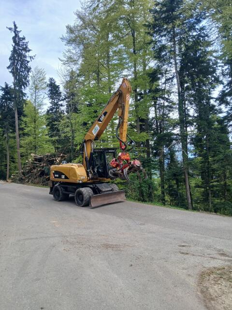 Cat M318D mit Woody 60, M318D