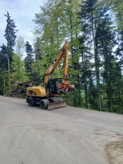 Cat M318D mit Woody 60, M318D