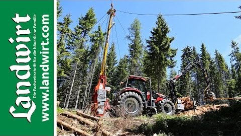 Traktor mit Seilkran und Prozessor