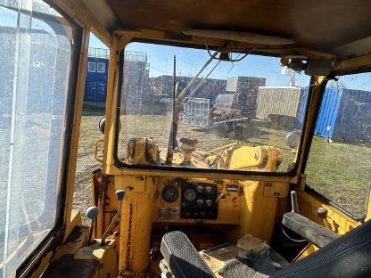 Bild 5:John Deere Laderaupe mit Heckbagger JD 450AA