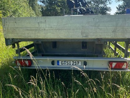 Bild 7:Claas Ares 836 mit Ladekran und Tandem-Anhänger 25 t Moog MZA21