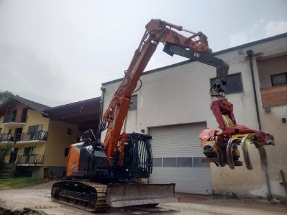 Kurzheckbagger Hitachi ZX225 mit Woody WH60-1