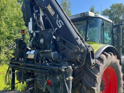 Bild 3:Claas Ares 836 mit Ladekran und Tandem-Anhänger 25 t Moog MZA21