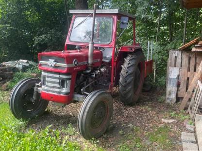 Massey Ferguson MF148 Multi-Power mit Heckschaufel