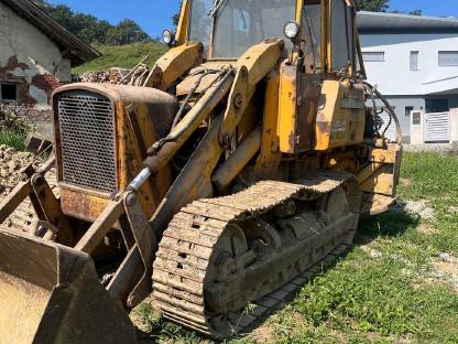 John Deere 450A Laderaupe mit Heckbagger