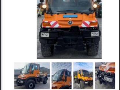 Unimog mit Winterdienst und Kran